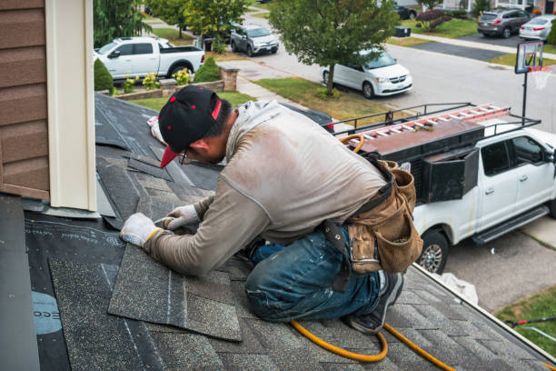 Professional Roofing technician working in Kensington, MD